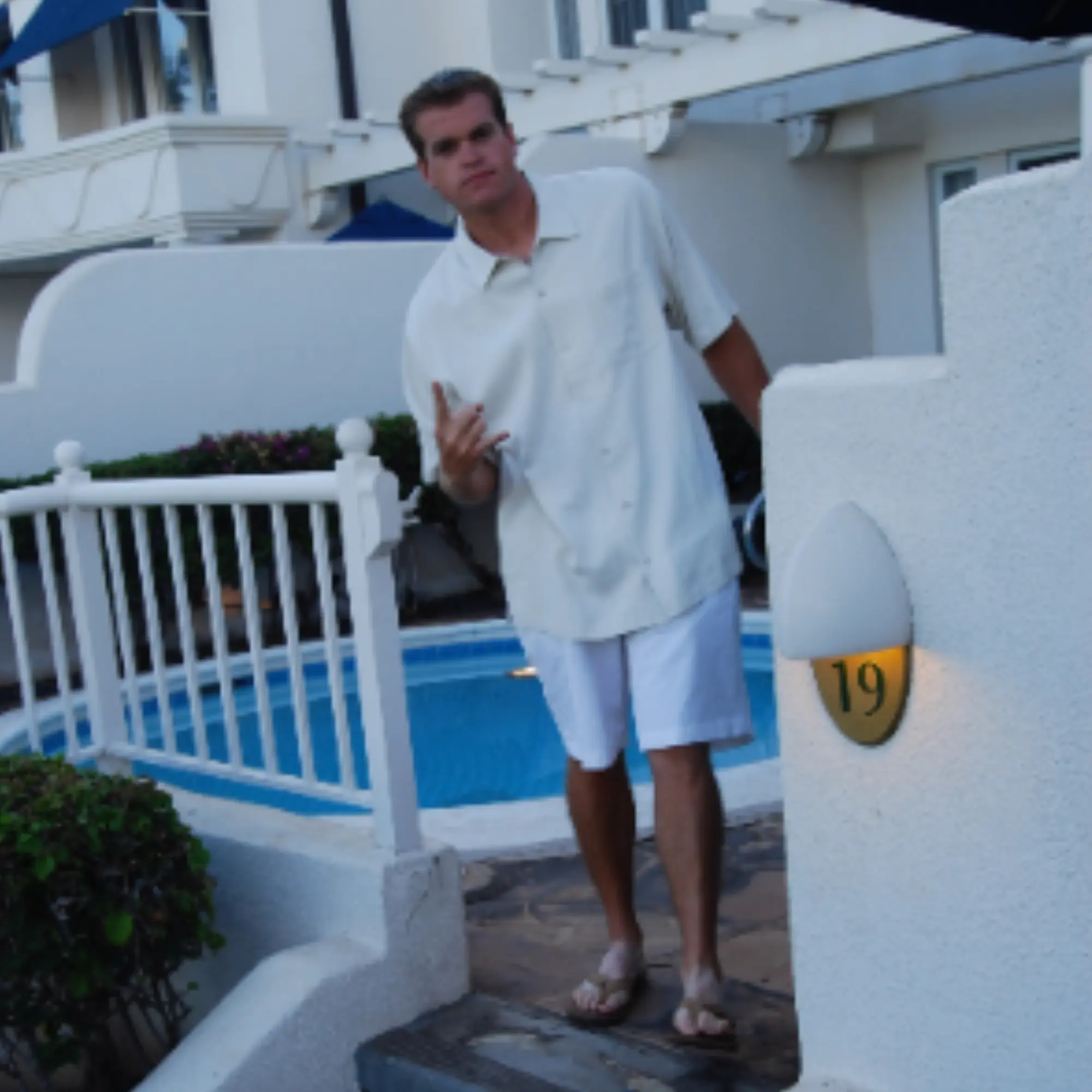 Candid portrait by a poolside courtyard